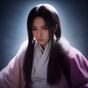 数据分析师在笔记本电脑前整理用户调研问卷的职业形象照，桌面摆放图表打印稿